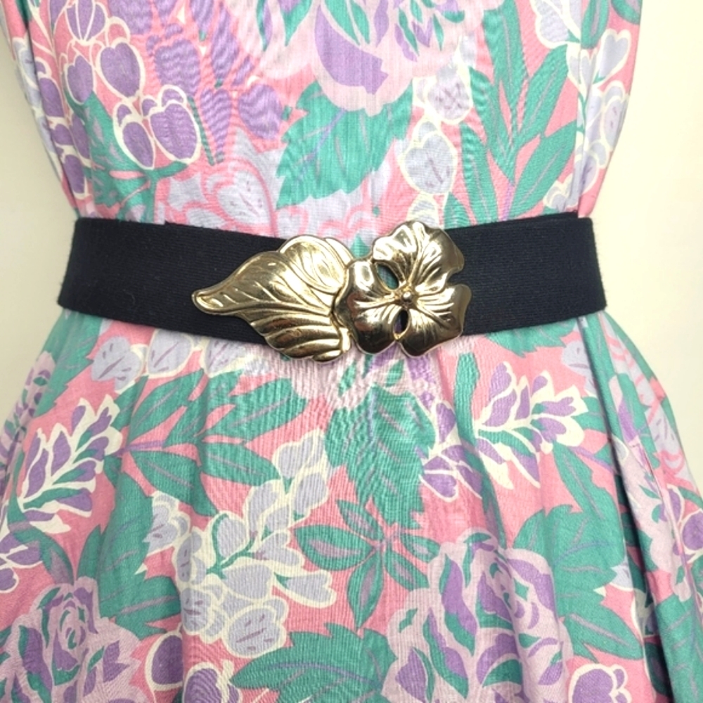 Vintage black waist belt with silver floral buckle